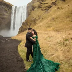 Crafting a couple's look is about harmony. His classic black suit complements her dramatic green gown without competing, ensuring they both look like the stars of their own movie.