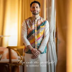 Step into the spotlight in vibrant hues. For his Sangeet, we styled the groom in a classic kurta-pajama elevated by a colorful Nehru jacket from Liz Paul, full of intricate patches and embroidery.