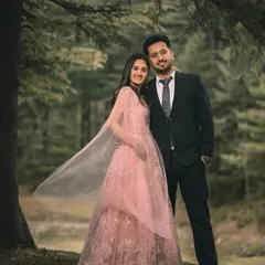 A classic portrait in the woods, with the flowing cape of her pink gown adding a touch of movement and elegance to the scene.