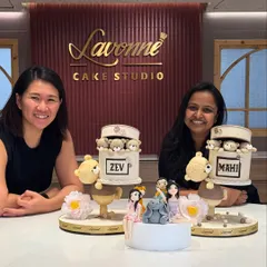 I’m so blessed to create cakes that celebrate special moments. Here I am with a happy client and her custom cakes, including fondant family figurines and teddy bears. Each cake tells a unique story.