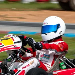 A close-up action shot of our driver in the BirelART kart, showcasing the focus required to compete at the front of the pack in events like the Meco Karting Cup.