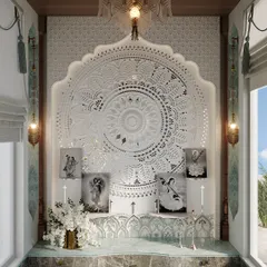 A closer view of the mandir, showing the intricate jali work and the framed images of deities. The space feels both elegant and deeply personal, a true heart of the home.
