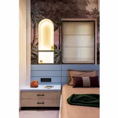 Another detail of the arched niche, which adds architectural interest and a soft, warm glow to the bedside area.