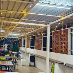 A wider shot of the festive decor at the Bizom office. You can see how the string lights span the entire length of the semi-outdoor space, ensuring the whole area feels warm and inviting.