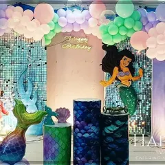 An enchanting mermaid theme for a magical birthday. I used custom props like a large mermaid tail and shimmering backdrops to create a dreamy underwater world for the celebration.