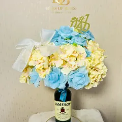 A still shot of the Jameson whiskey floral hamper, topped with a "#1 Dad" accessory.