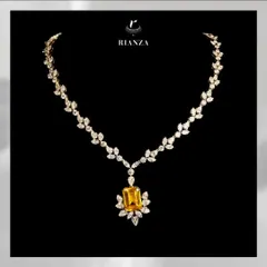 This exquisite necklace, featuring a 25-carat yellow sapphire and diamonds, is a statement piece that can be acquired at a more accessible price point than a full bridal set.