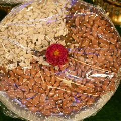 Another example of a dry fruit plate, neatly wrapped and ready for display at a ceremony.