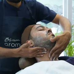 The grooming ritual begins with a gentle facial massage. I use my natural, aromatherapy-based products to prepare the skin, ensuring a smooth and irritation-free shave.