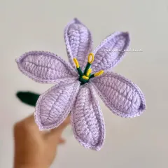 A close look at the beautiful lavender crochet lily. This color is so calming and elegant, perfect for a sophisticated floral arrangement or as a single stem.