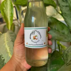 A bottle of my wonderfully fragrant, cold-pressed coconut oil. The coconuts are grown without any chemicals on our Uttam Sagar Estate, making the oil pure and full of natural flavor.