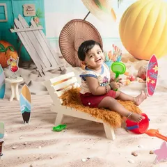 After splashing in the tub, this little one is enjoying some time on the "sand." The beach theme allows for a variety of shots, both in and out of the water, to capture your toddler's playful spirit.