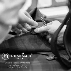Every detail is crafted by hand. Here, a button is being carefully stitched onto a jacket, a small but essential step that ensures the quality and longevity of your bespoke piece.