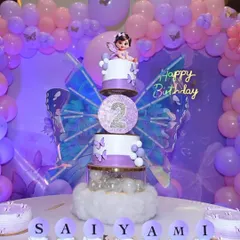 Personalized cupcakes spelling out "SAIYAMI" for her butterfly-themed birthday party.