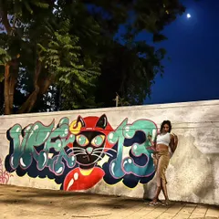 A cat, the moon, my art, and a whole lot of attitude. This is me in my element as Vrek13, my street art tag. I turn blank city walls into bold stories, one spray can at a time.
