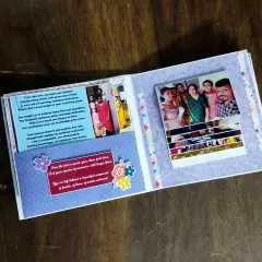 This page from the professor's scrapbook includes a pocket for messages and a waterfall card for photos of her with her students.