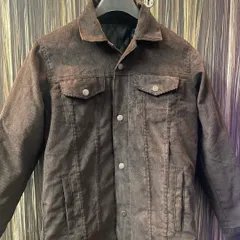 This is a custom-made corduroy jacket in a rich brown, featuring a classic trucker design with flap pockets and a warm, quilted inner lining for extra comfort.