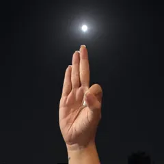 A hand gesture, or mudra, directed towards the full moon. Each part of our ceremony, from affirmations to moon gazing, is a step on a soulful journey to connect with our inner and outer worlds.