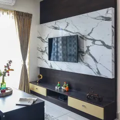 A different angle of the dark wood and marble-finish TV unit, showing how it anchors the living room space.
