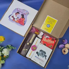 A perfect Rakhi gift for a brother, this hamper includes a personalized wallet, wireless earbuds, chocolates, and a traditional rakhi with roli chawal, all packed in a custom-illustrated box.