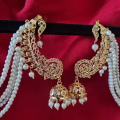 A close look at our gold-plated Hyderabadi Kimaya Earcuffs. Notice the intricate Jadau work and the cascade of pearls. This is a statement piece that blends royal heritage with modern craftsmanship, perfect for a bride or a wedding guest.