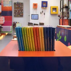 This was our first store in the DLF Centre Mall in Gurgaon. We painted old trunks, built our own pinboards, and filled the space with things we loved, like these colorful handmade journals.