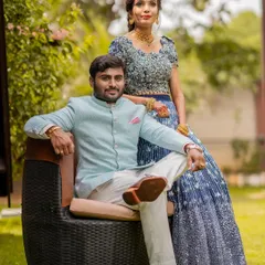 The happy couple at their ring ceremony. The bride's makeup is natural and radiant, perfect for an outdoor, daytime event.