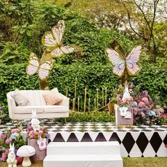 Another view of the main stage, highlighting the combination of the bold checkerboard pattern with soft, romantic florals and delicate butterfly cutouts.