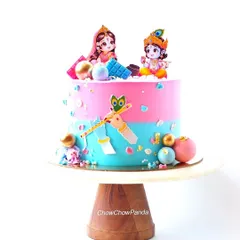 A cute baby shower cake with a Radha Krishna theme. This Chocolate Truffle cake uses a pink and blue design, perfect for a gender reveal or a traditional celebration.
