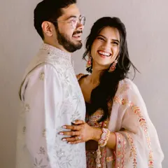 The kind of laughter that fills a room. This candid black and white portrait captures the genuine happiness and easy comfort between a couple.