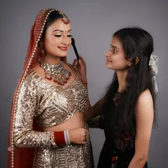A beautiful moment between a student and her model. My training focuses not just on technique, but also on building a gentle and professional rapport with clients.