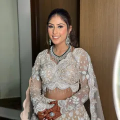 The full bridal look, showing how the makeup perfectly complements the intricate outfit and jewelry.