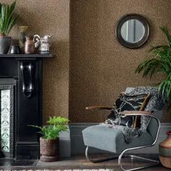 Cole & Son’s Senzo Spot captures the playful charm of giraffe spots. This refined, semi-plain wallpaper features delicate metallic daubs on a rich brown background, adding subtle texture and a touch of the wild.