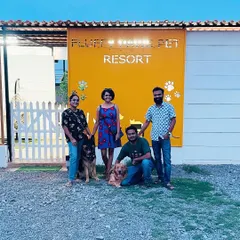A happy family photo in front of our resort sign. We love being a place where families can create lasting memories with their pets.