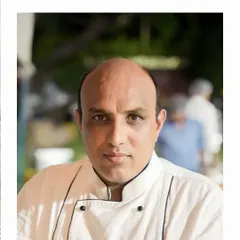 A portrait of one of our experienced head chefs, who leads the culinary team in creating memorable dining experiences.