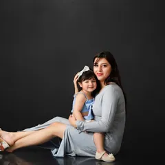 A sweet cuddle between a mother and her little girl. These relaxed, intimate portraits capture the natural affection and connection that defines their relationship.