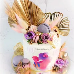 This beautiful cake was a Mother's Day special, decorated with trending elements like golden ginkgo leaves, palm spears, and macarons. The watercolor-style edible print adds a soft, artistic touch.