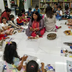 It's not just about listening to stories; it's about creating them too. Here, I'm guiding children as they make their own clay Ganeshas during our 'Ganpati ki Gaathayein' workshop. This hands-on activity helps them connect with the story on a deeper, more personal level.