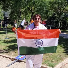 Our director proudly holding the Indian flag in Portugal. This level of experience and passion is what we bring to our coaching every single day.