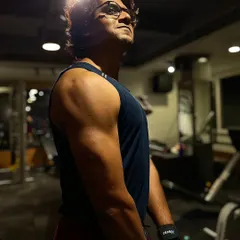 This client is on day five of his lean bulking program, focusing on shoulder development. You can already see the muscle definition and progress from our dedicated training sessions.
