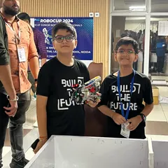 Here are the Rescue Rangers right before their competition run. Their robot is designed to navigate a maze using sensors and deliver a rescue kit, a challenge that required over a month of focused building and programming.