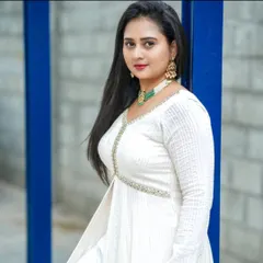 A beautiful shot of actress Amulya in the white chikankari Anarkali I designed for her. The green stone necklace provides a perfect pop of color against the white fabric.