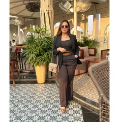 A well-fitted blazer is a cornerstone of any power wardrobe. Here, I've styled a dark co-ord set with a structured blazer, creating a look that is both professional and incredibly chic for any corporate setting.