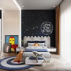 A superhero and space-themed bedroom for a little adventurer. The starry night accent wall with a neon sign, combined with Iron Man artwork, creates a room that sparks imagination.