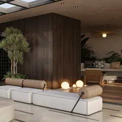 Lush greenery and warm, spherical floor lamps are integrated into the terrace design, softening the architecture and creating a magical ambiance at dusk. The dark wood paneling adds a sense of warmth and enclosure.
