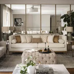 A closer look at the sofa against the mirrored wall, showing how we use reflective surfaces to enhance light and create a sense of spaciousness.