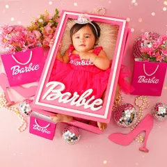 A real-life Barbie doll! This creative shot places the baby inside a custom-made Barbie box for a truly unique and memorable portrait.