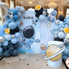 Blast off into fun with a space-themed birthday party. For Ankit's celebration, I designed a complete astronaut setup with a large backdrop, planet cutouts, a silver moon, and balloon garlands that look like galaxies.