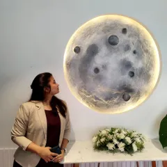 Admiring the finished 3D moon art piece. It’s always a joy to see a concept that started as a sketch come to life and bring its calming presence into a client's space.