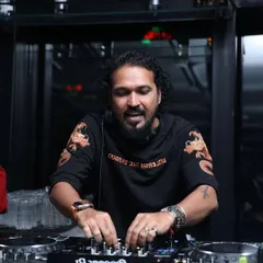 In my element during a New Year's Eve set in Thane. I am focused on the mix, lining up the perfect track to welcome the new year with a bang.